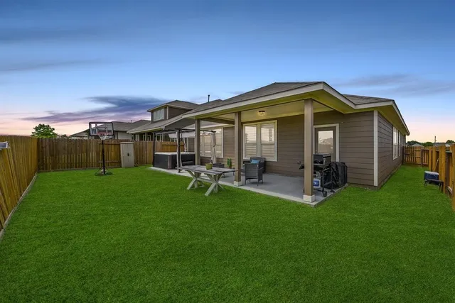 a view of a house with backyard porch and garden