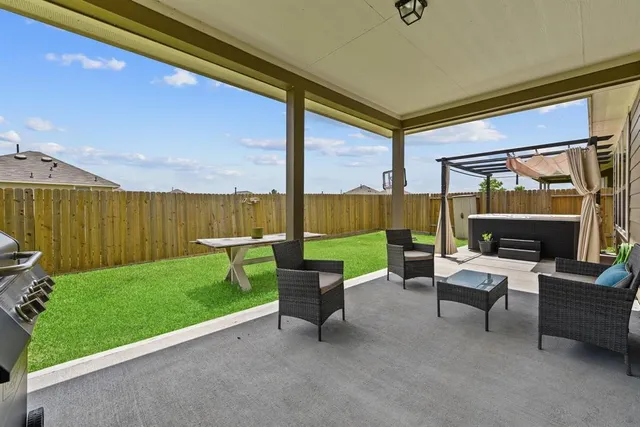 a view of yard with seating area and furniture