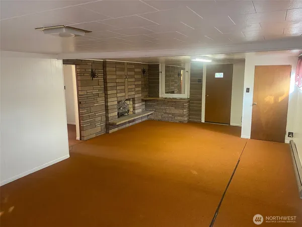 a view of an empty room with closet area