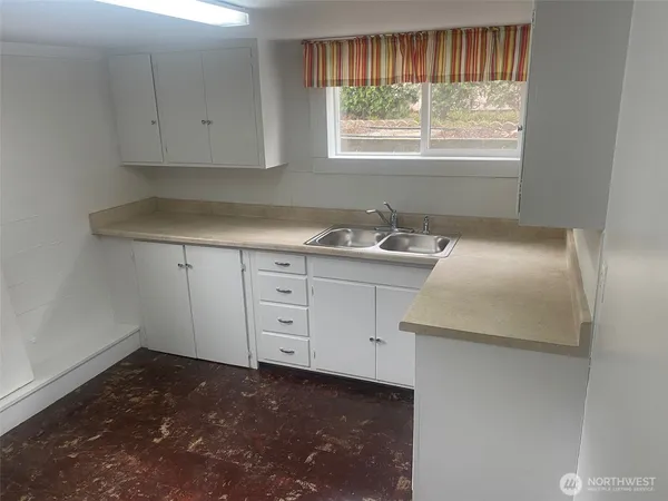 a room with cabinets and window