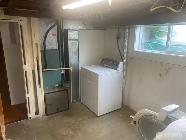 a view of storage and utility room with washer and dryer