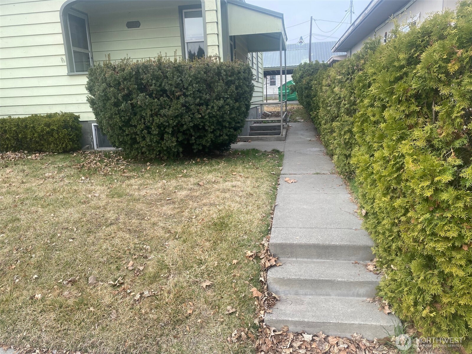 220 West Apple Street Omak, WA 98841 - Photo 20 of 27 a view of a pathway with flower plants
