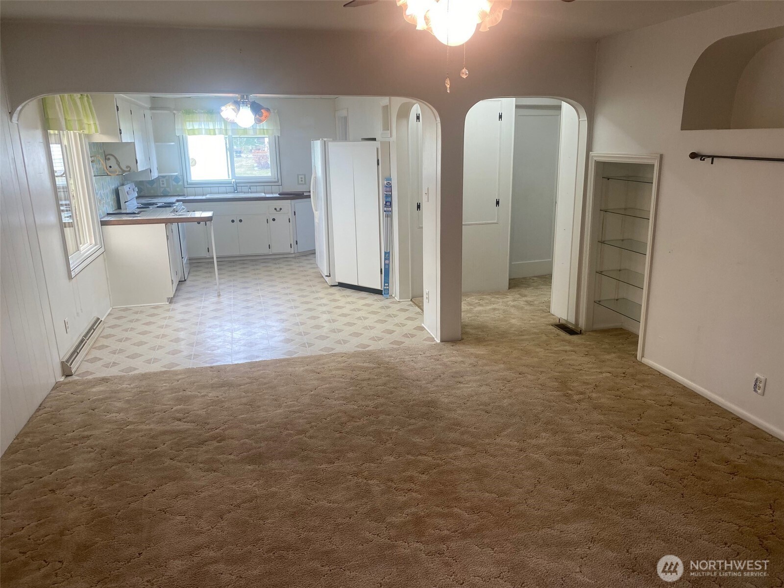 220 West Apple Street Omak, WA 98841 - Photo 8 of 27 a view of a kitchen with refrigerator and window