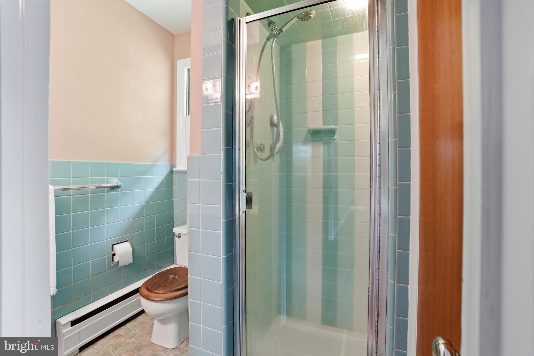 486 Derstine Road Hatfield, PA 19440 - Photo 24 of 53 a bathroom with a granite countertop toilet a sink and shower