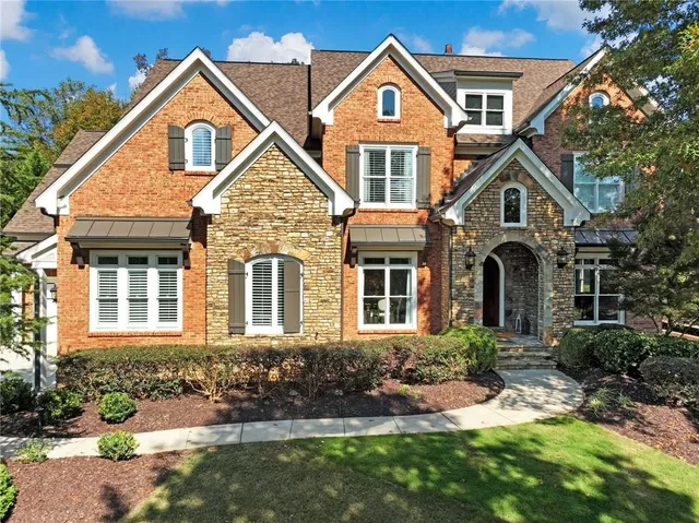 a living room with furniture a rug and a window