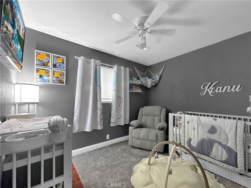 6800 Helton Street Winton, CA 95388 - Photo 15 of 22 a living room with furniture and wooden floor