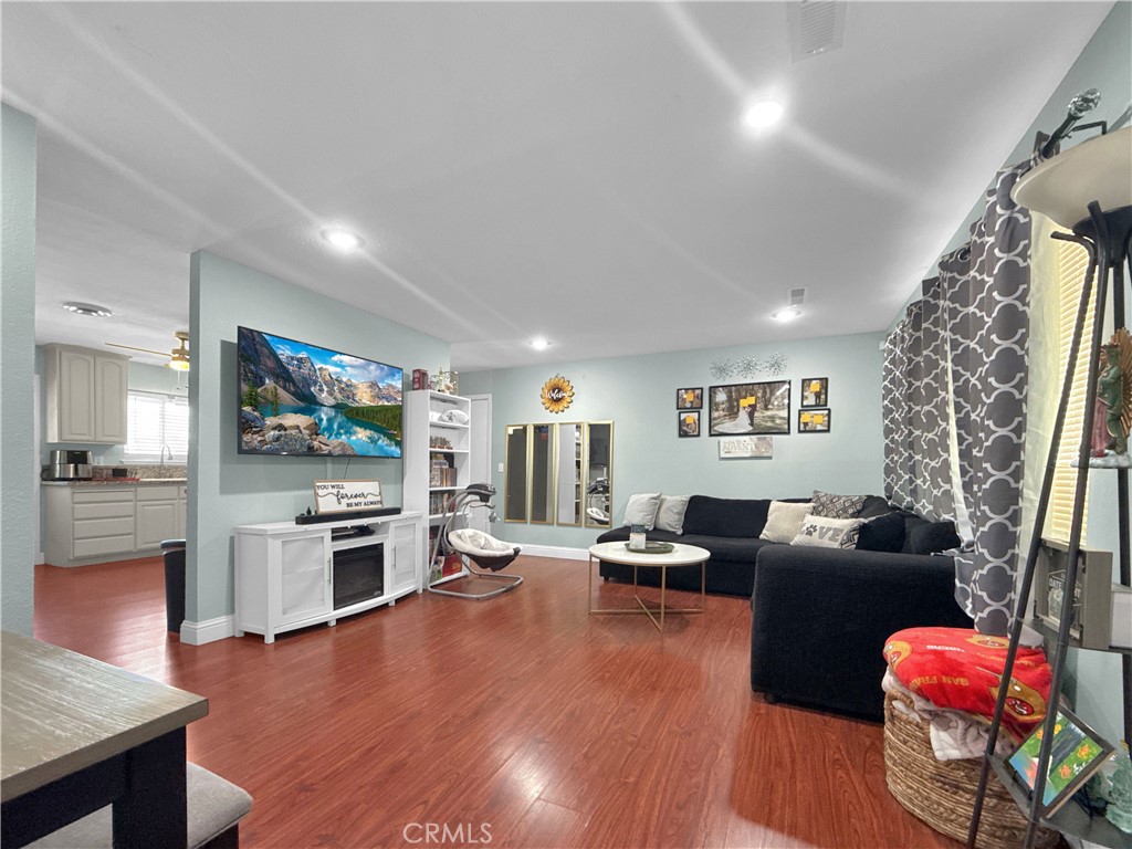 6800 Helton Street Winton, CA 95388 - Photo 16 of 22 a living room with furniture window and wooden floor