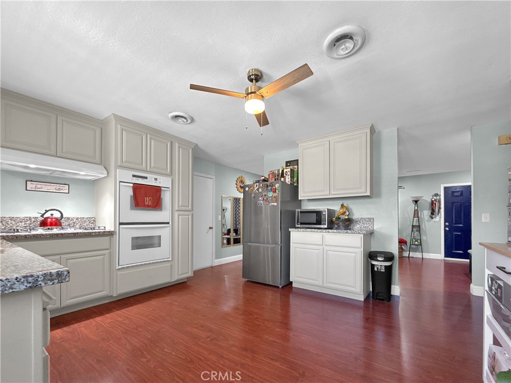 6800 Helton Street Winton, CA 95388 - Photo 21 of 22 a kitchen view with furniture a refrigerator and a sink
