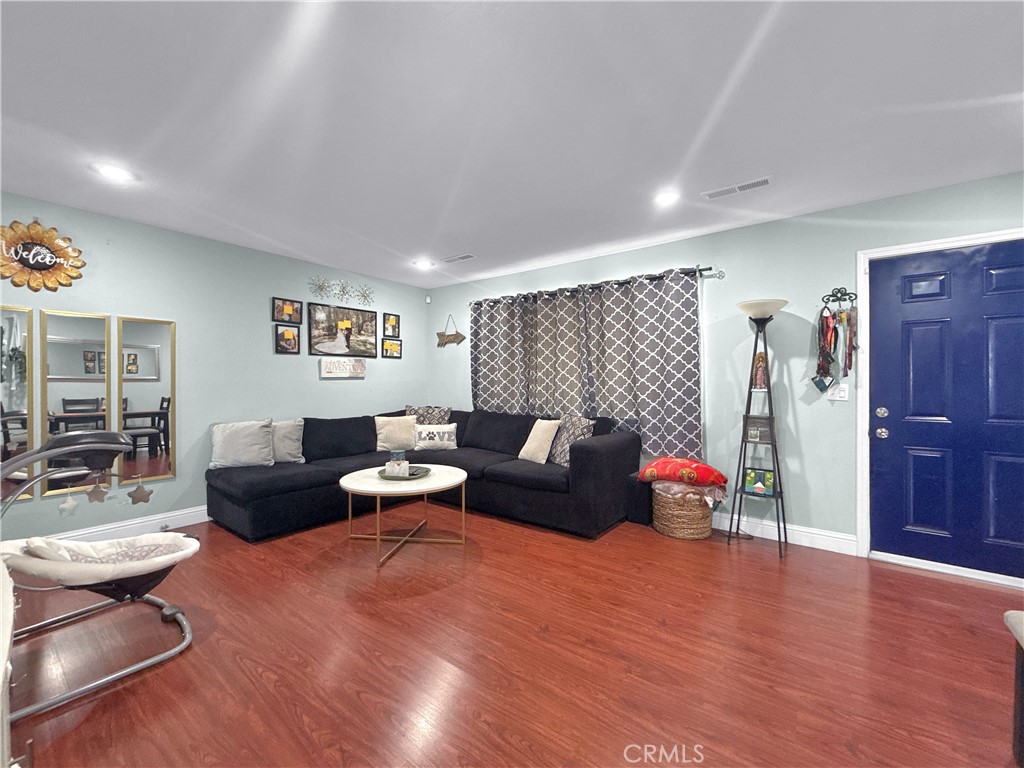 6800 Helton Street Winton, CA 95388 - Photo 4 of 22 a living room with furniture and wooden floor