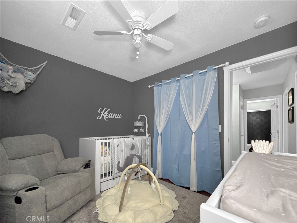 6800 Helton Street Winton, CA 95388 - Photo 5 of 22 a living room with furniture and a chandelier