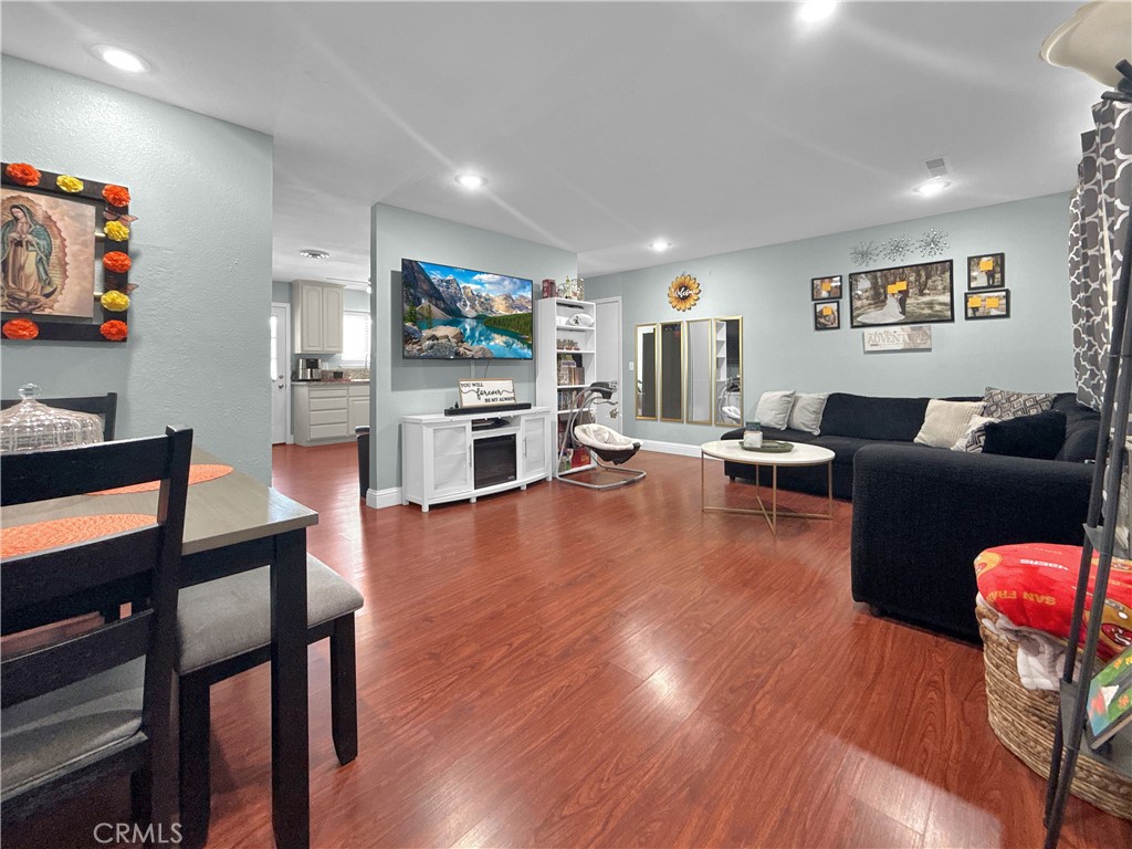 6800 Helton Street Winton, CA 95388 - Photo 7 of 22 a living room with furniture wooden floor and a flat screen tv