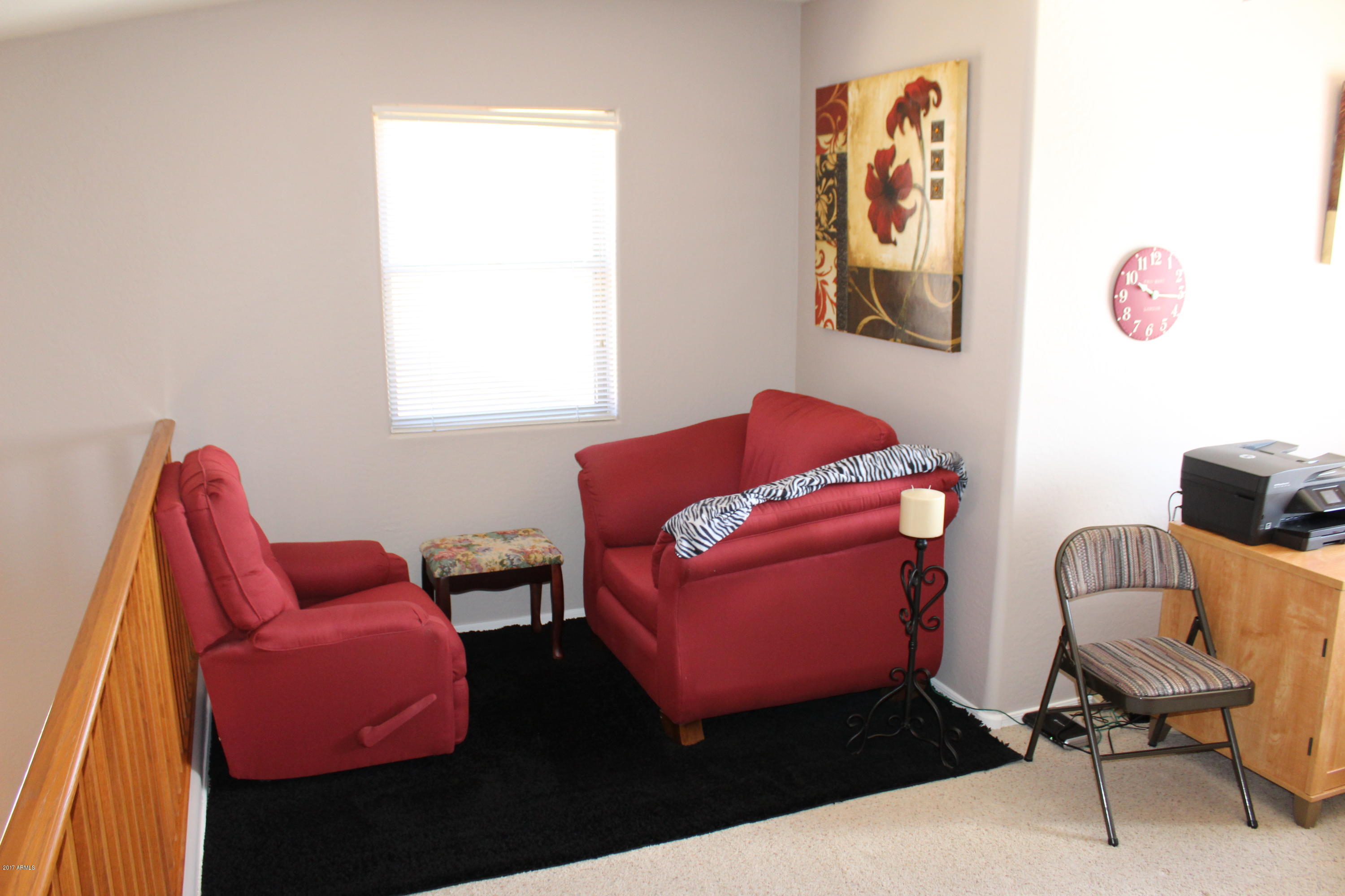 44 South Greenfield Road, Unit 23 Mesa, AZ 85206 - Photo 18 of 28 a room with furniture and a chair