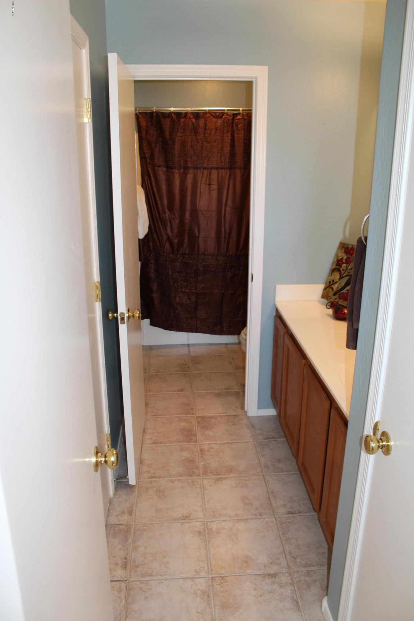 44 South Greenfield Road, Unit 23 Mesa, AZ 85206 - Photo 20 of 28 a bathroom with a sink a toilet and a shower