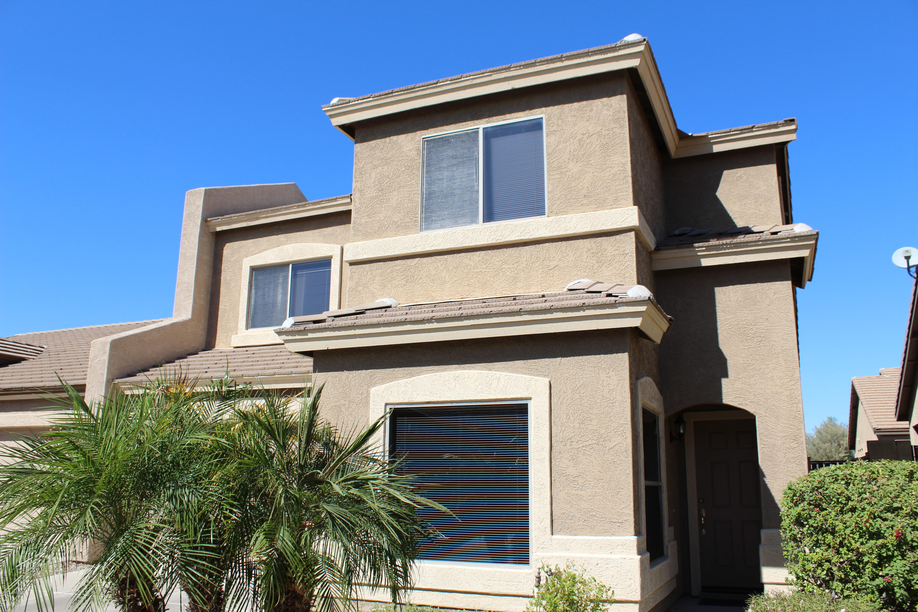 44 South Greenfield Road, Unit 23 Mesa, AZ 85206 - Photo 2 of 28 a front view of a house with plants
