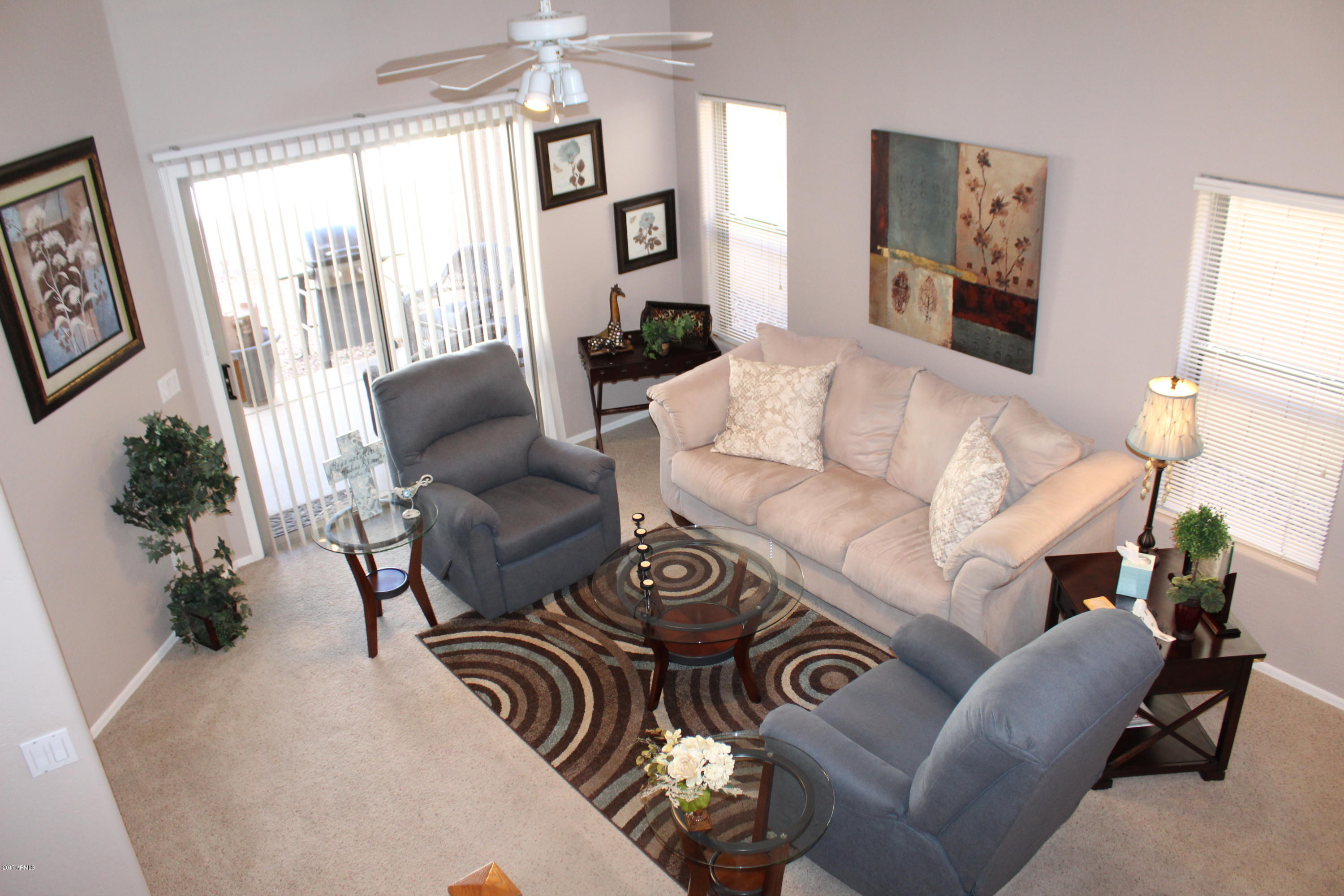 44 South Greenfield Road, Unit 23 Mesa, AZ 85206 - Photo 9 of 28 a living room with furniture and a large window
