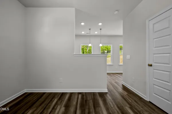 a view of kitchen with wooden floor and window
