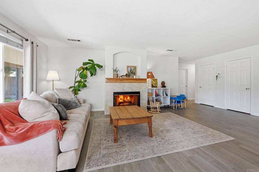 618 Jacks Creek Road Escondido, CA 92027 - Photo 16 of 48 a living room with furniture and a fireplace