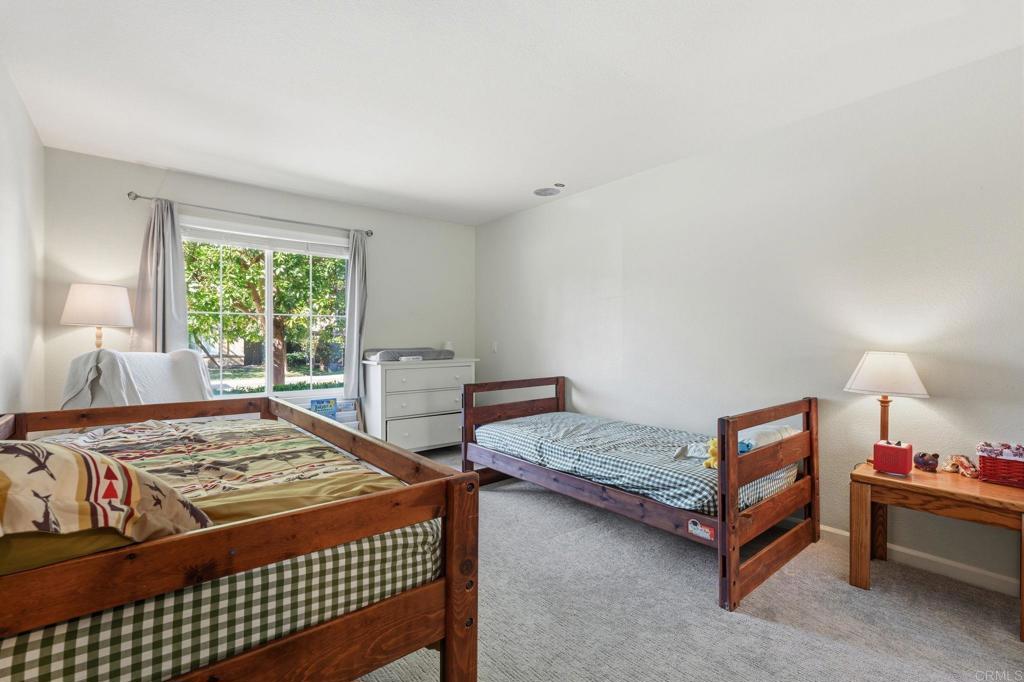 618 Jacks Creek Road Escondido, CA 92027 - Photo 24 of 48 a bedroom with a bed and a window