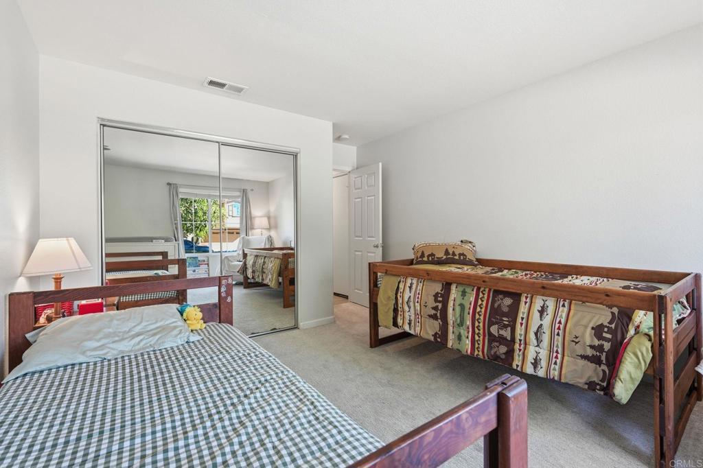 618 Jacks Creek Road Escondido, CA 92027 - Photo 25 of 48 a bedroom with furniture and a wooden floor
