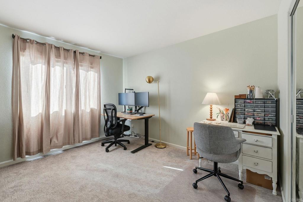 618 Jacks Creek Road Escondido, CA 92027 - Photo 27 of 48 a view of a workspace with furniture and a window