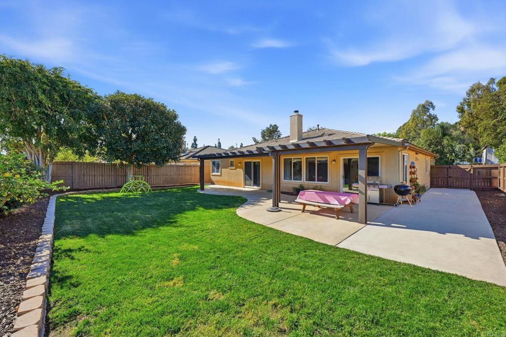 618 Jacks Creek Road Escondido, CA 92027 - Photo 30 of 48 a view of a house with backyard porch and sitting area