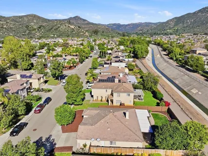an aerial view of residential houses with outdoor space