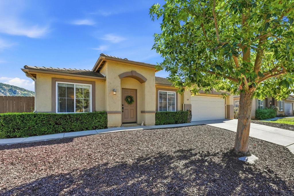 618 Jacks Creek Road Escondido, CA 92027 - Photo 48 of 48 a front view of a house with a yard and trees
