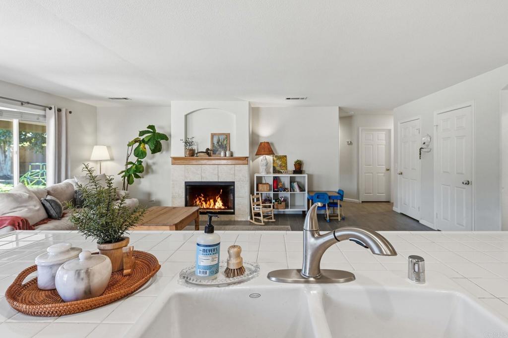 618 Jacks Creek Road Escondido, CA 92027 - Photo 10 of 48 a living room with furniture a fireplace and potted plant