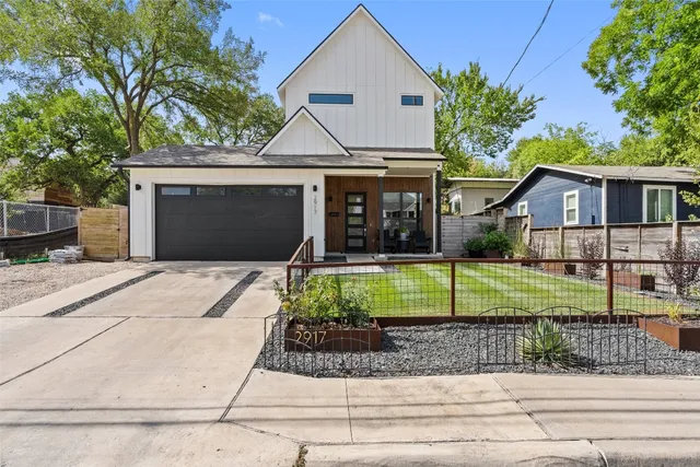 a front view of a house with a yard and porch