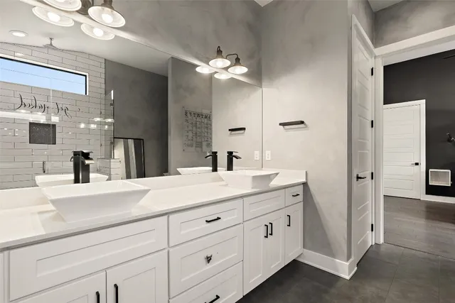 a bedroom with bed and painting on the wall