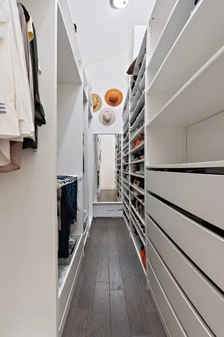 a spacious bathroom with a double vanity sink and a mirror