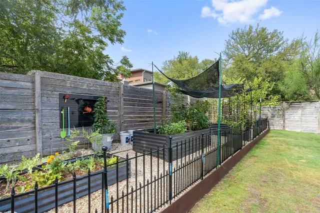 a house that has a tree in front of it