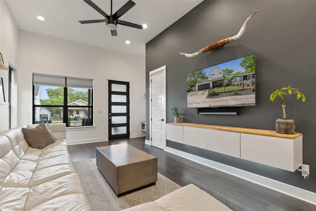 a living room with furniture and a large window