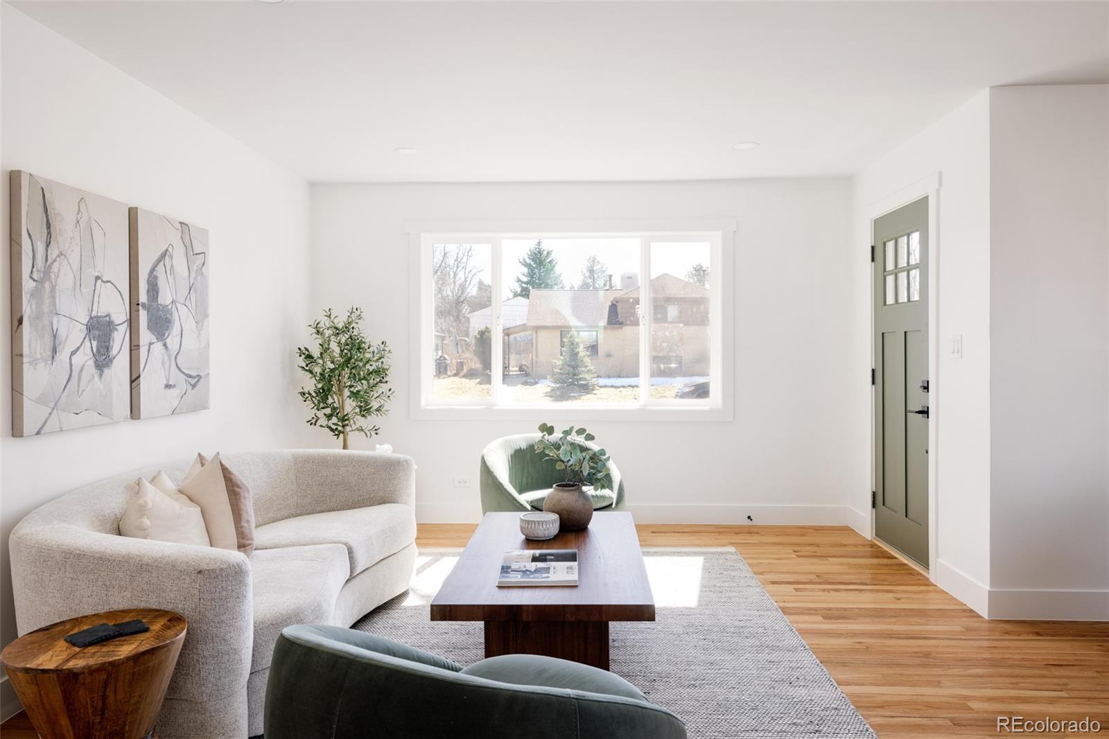 7255 West 35th Place Wheat Ridge, CO 80033 - Photo 11 of 30 a living room with furniture and a window