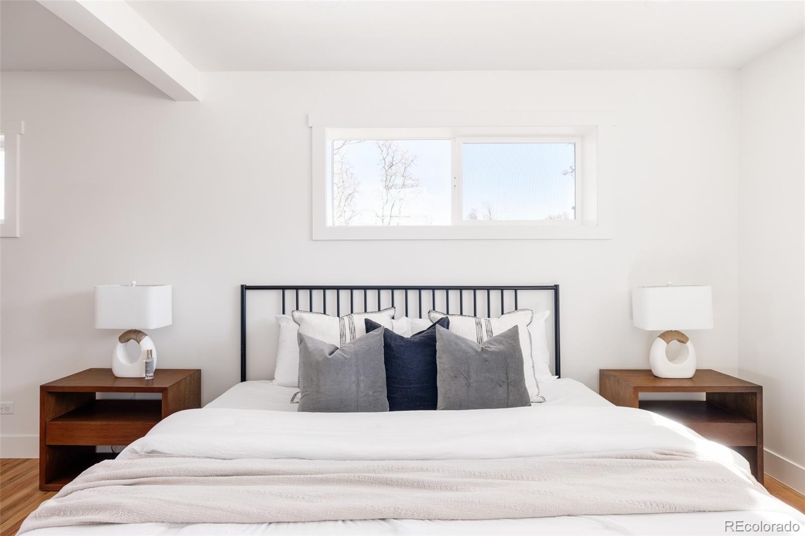 7255 West 35th Place Wheat Ridge, CO 80033 - Photo 19 of 30 a large white bed in a white room