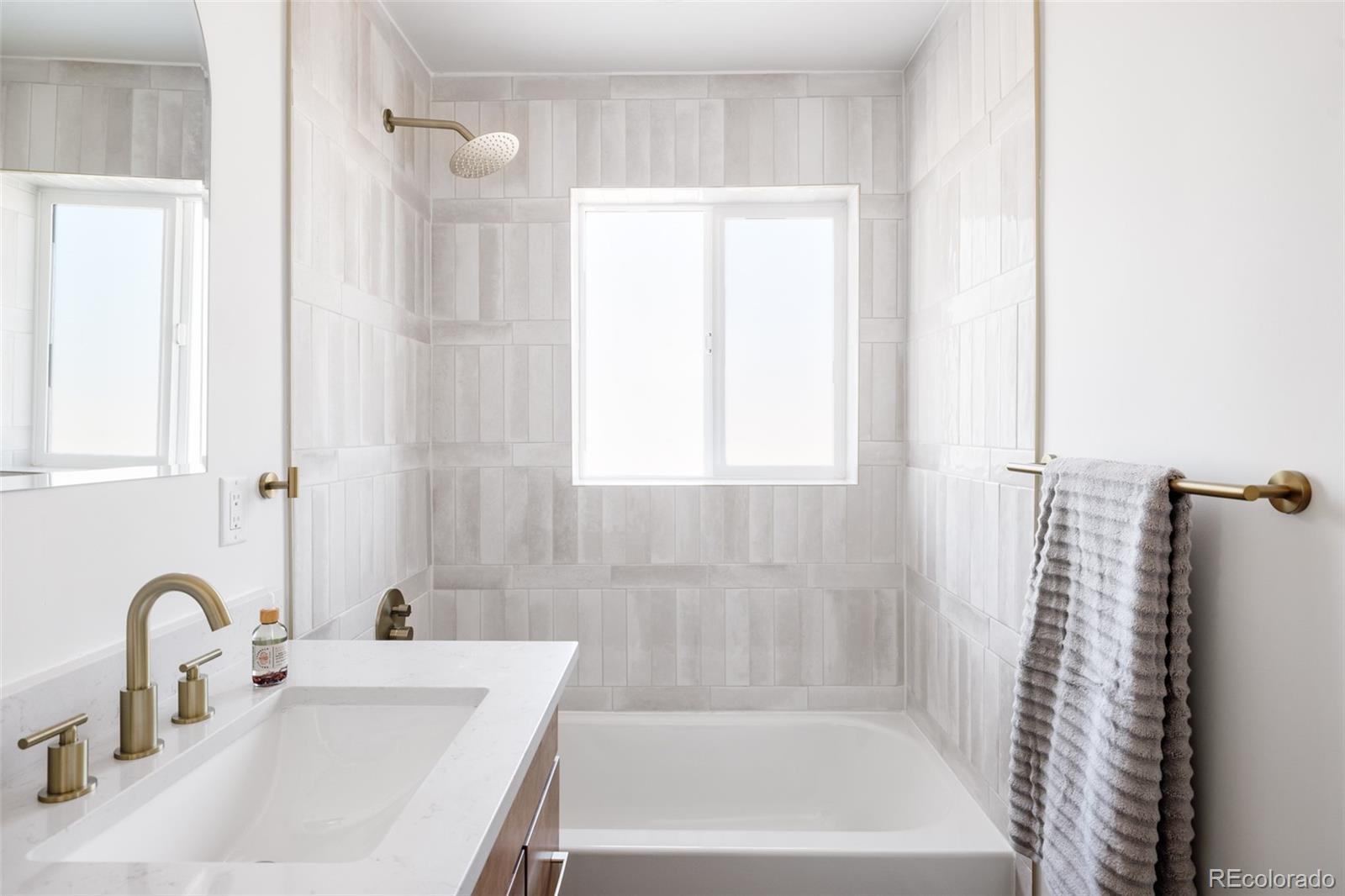 7255 West 35th Place Wheat Ridge, CO 80033 - Photo 22 of 30 a bathroom with a sink and a bathtub