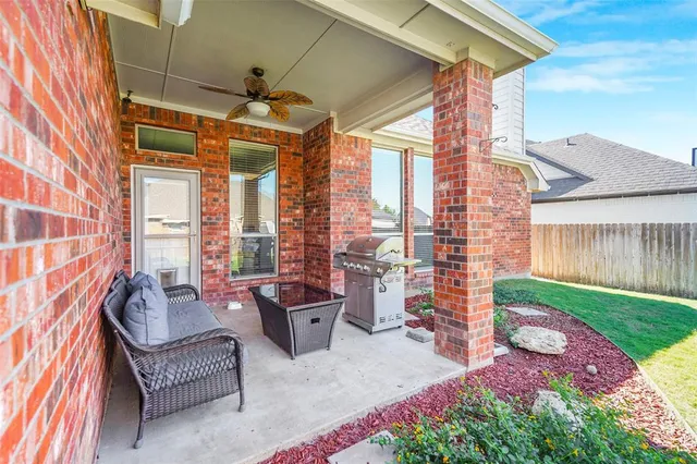 a balcony with furniture and a garden