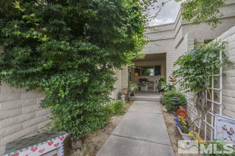 4829 Lakeridge Terrace West Reno, NV 89509 - Photo 1 of 1 a view of a pathway with potted plants and large tree