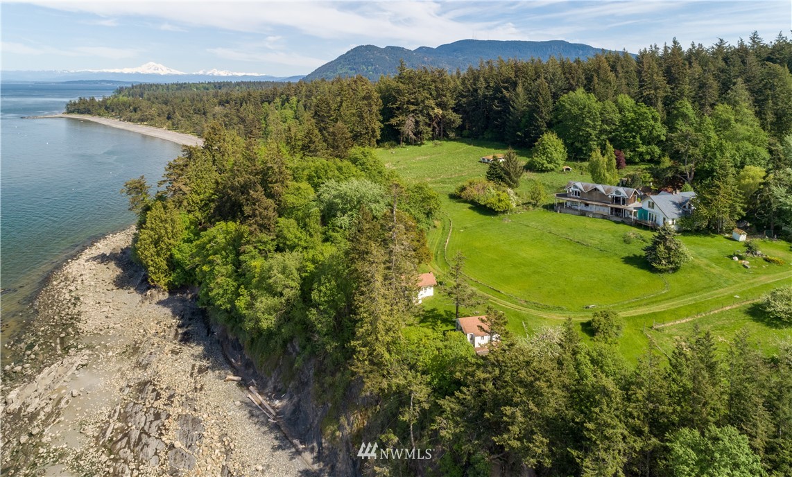 546 Glenwood Inn Road Orcas Island, WA 98245 - Photo 3 of 25 a view of a town with mountains in the background