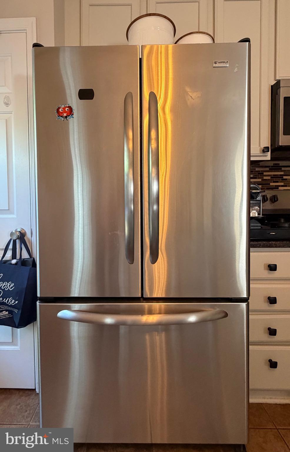 7108 Wheeling Way Gainesville, VA 20155 - Photo 14 of 45 a close view of a refrigerator in kitchen