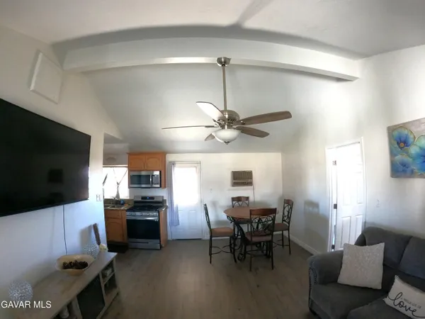 a view of a livingroom with furniture and a flat screen tv
