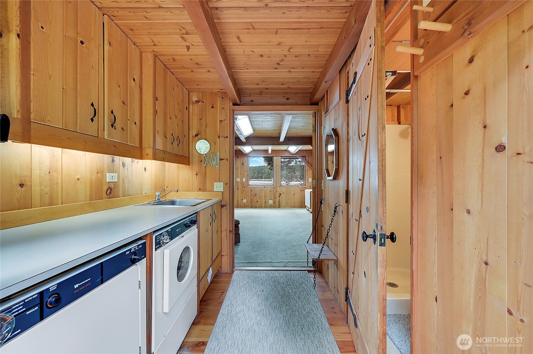 861 Griffith Point Road Nordland, WA 98358 - Photo 15 of 38 a kitchen with stainless steel appliances a refrigerator and a sink