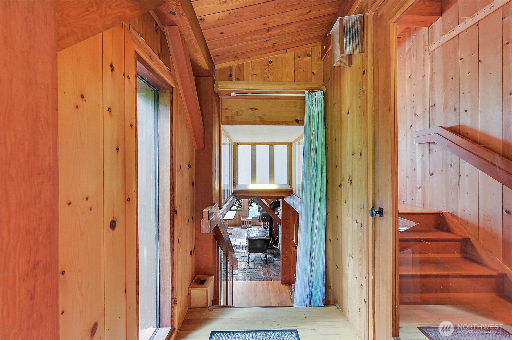 861 Griffith Point Road Nordland, WA 98358 - Photo 17 of 38 a view of a hallway with wooden floor and staircase