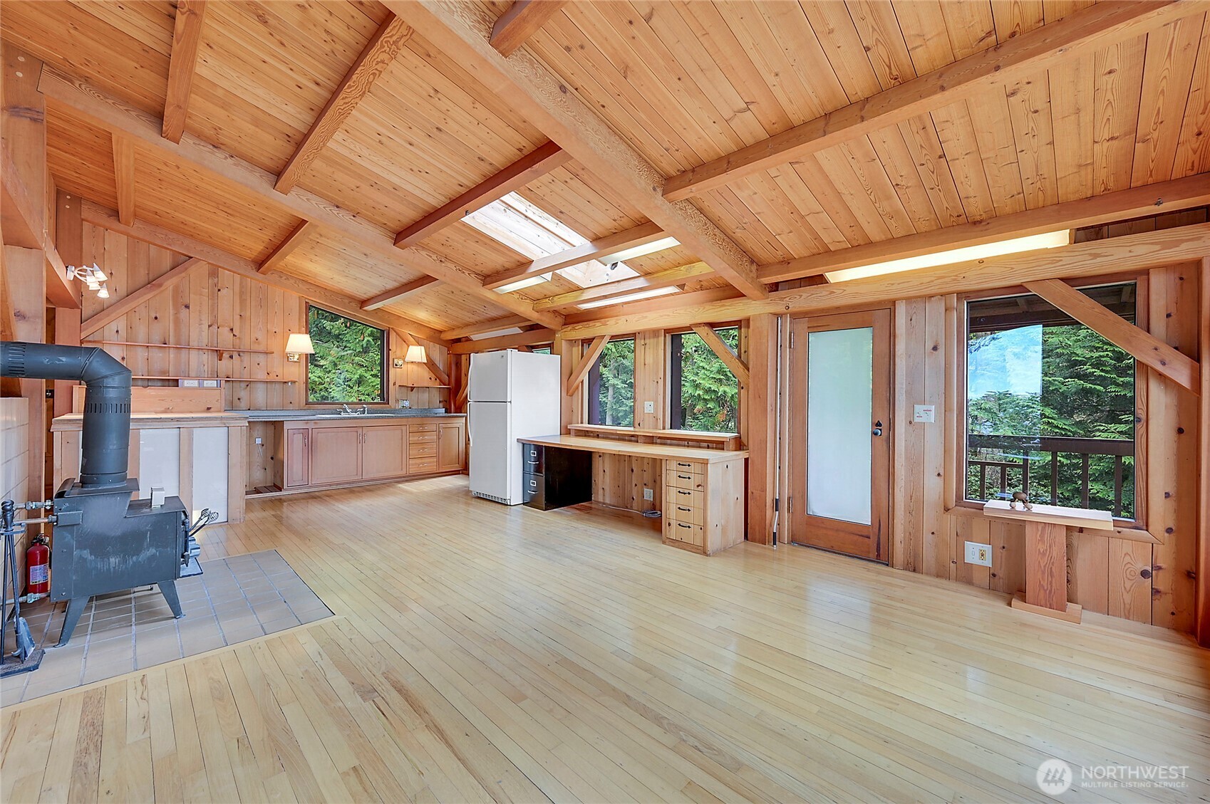 861 Griffith Point Road Nordland, WA 98358 - Photo 19 of 38 a view of a room with wooden floors and furniture