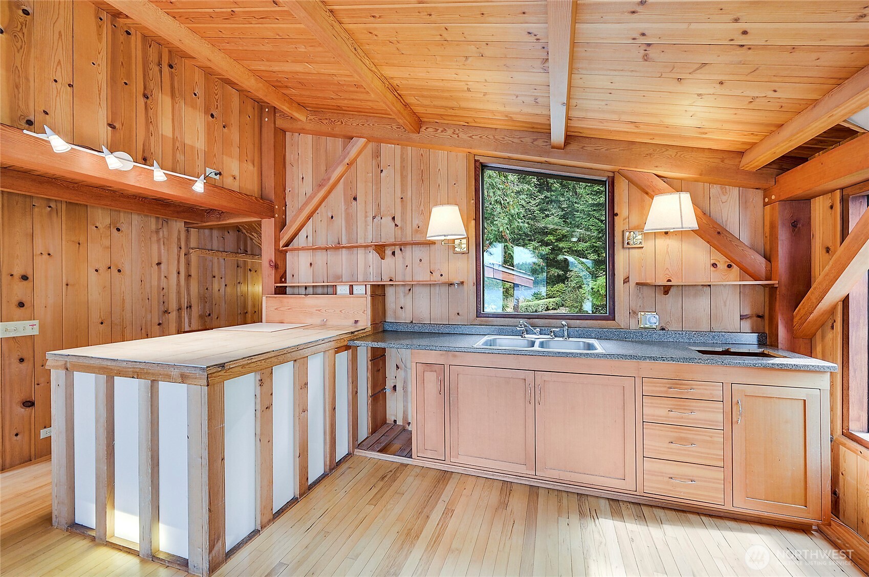 861 Griffith Point Road Nordland, WA 98358 - Photo 21 of 38 a view of a kitchen with wooden floor and electronic appliances