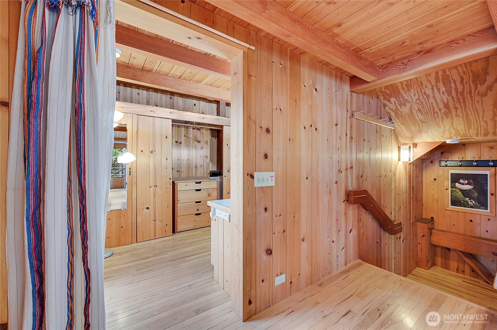 861 Griffith Point Road Nordland, WA 98358 - Photo 25 of 38 a view of a hallway with wooden floor and staircase