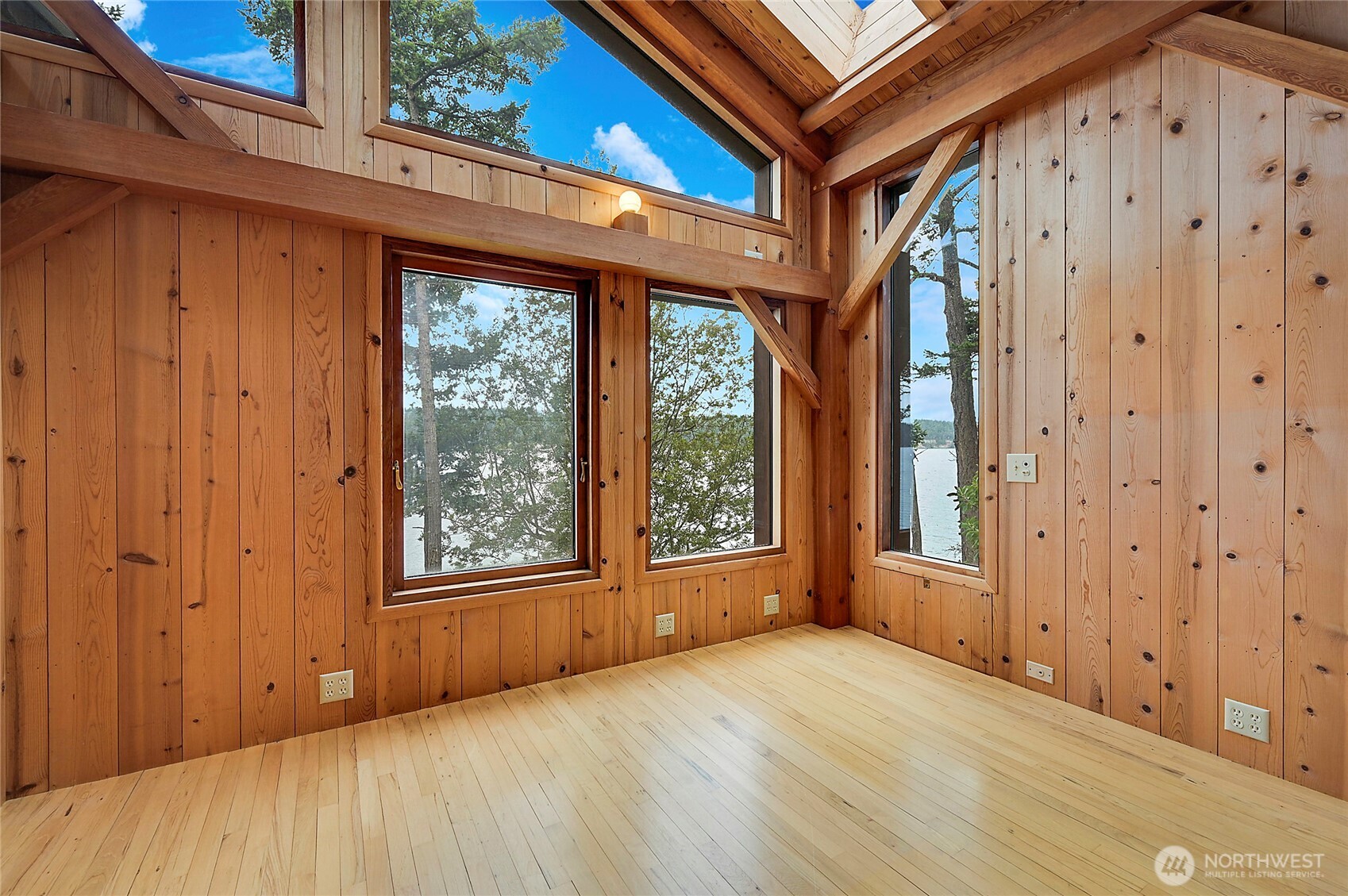 861 Griffith Point Road Nordland, WA 98358 - Photo 26 of 38 a view of an empty room with a window and wooden floor