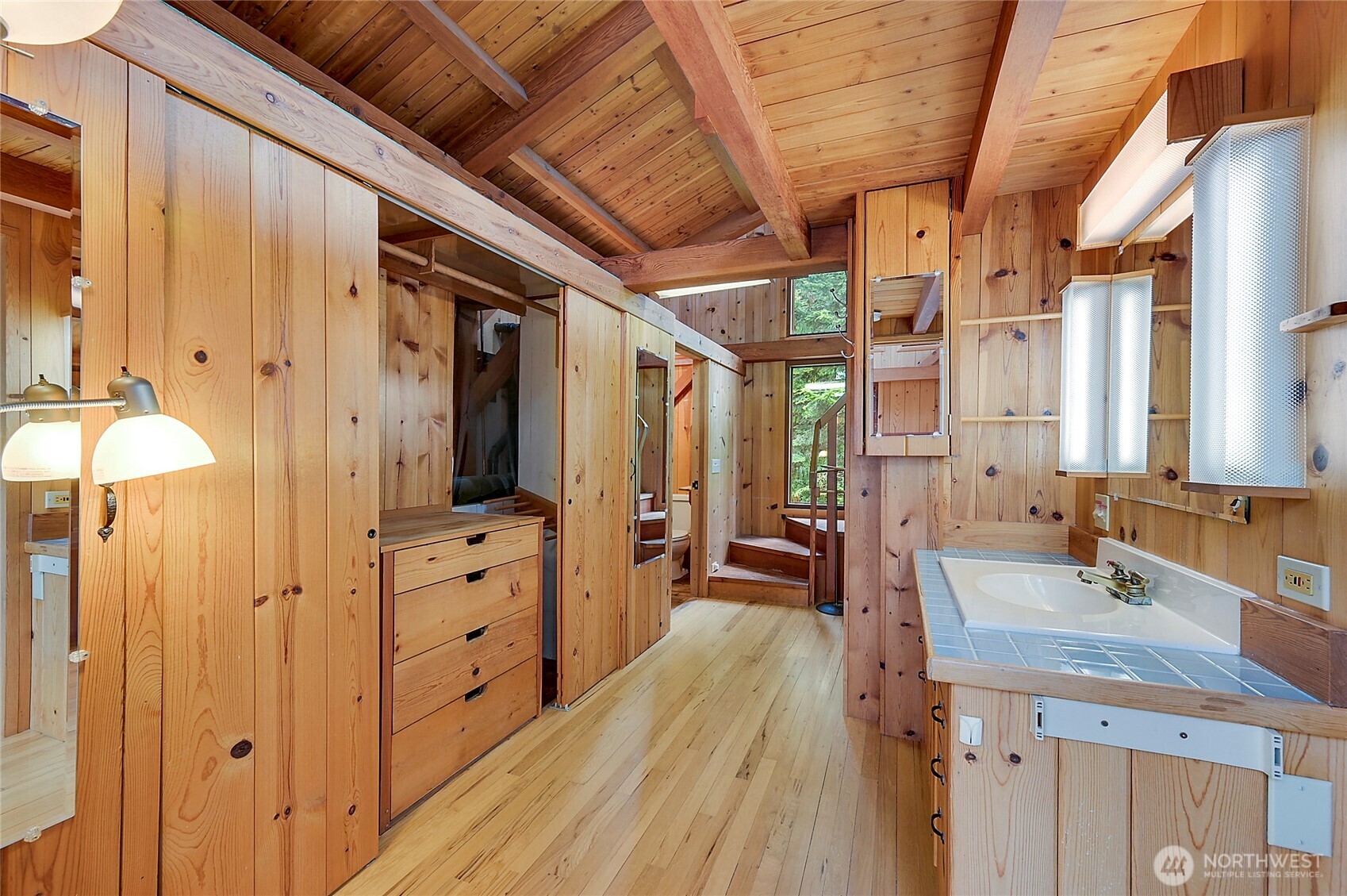 861 Griffith Point Road Nordland, WA 98358 - Photo 29 of 38 a spacious bathroom with a double vanity sink and a mirror