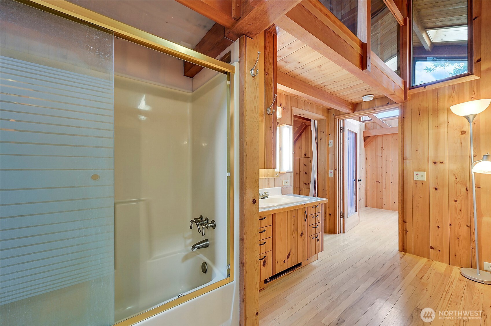 861 Griffith Point Road Nordland, WA 98358 - Photo 30 of 38 a bathroom with a glass shower door