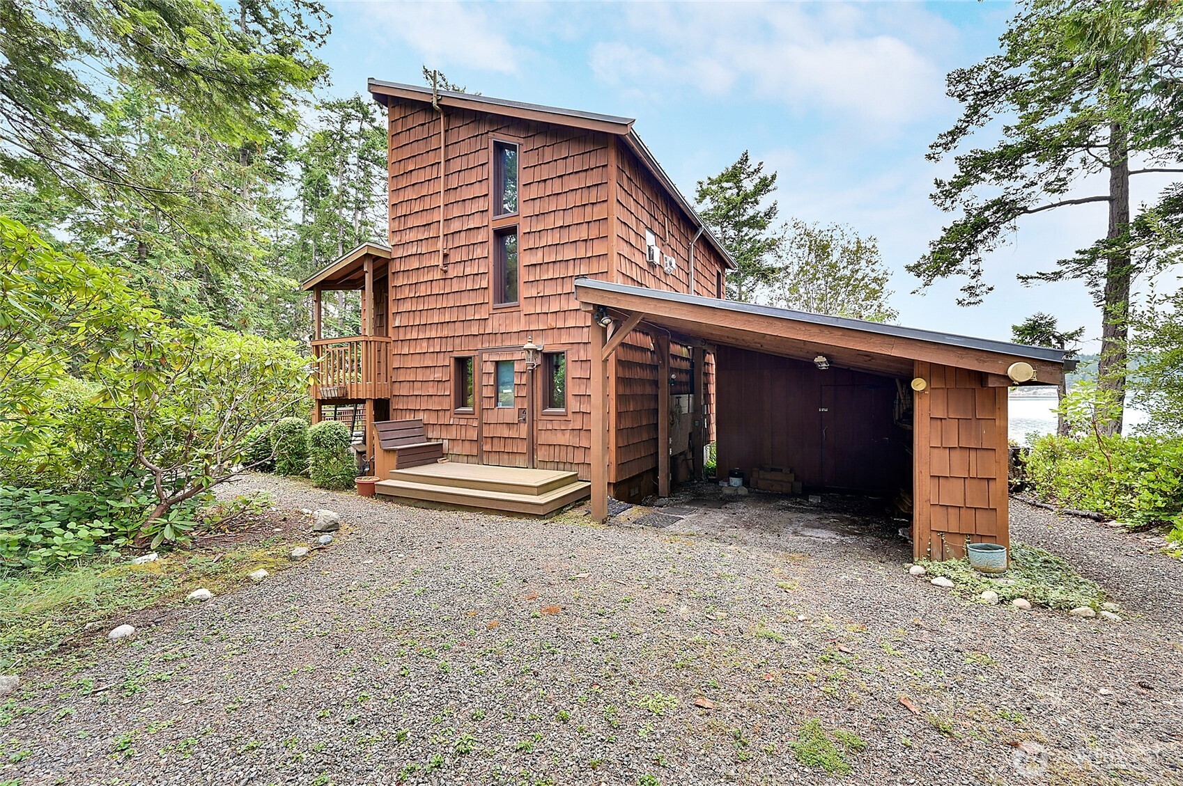 861 Griffith Point Road Nordland, WA 98358 - Photo 36 of 38 a view of a house with a yard and garage